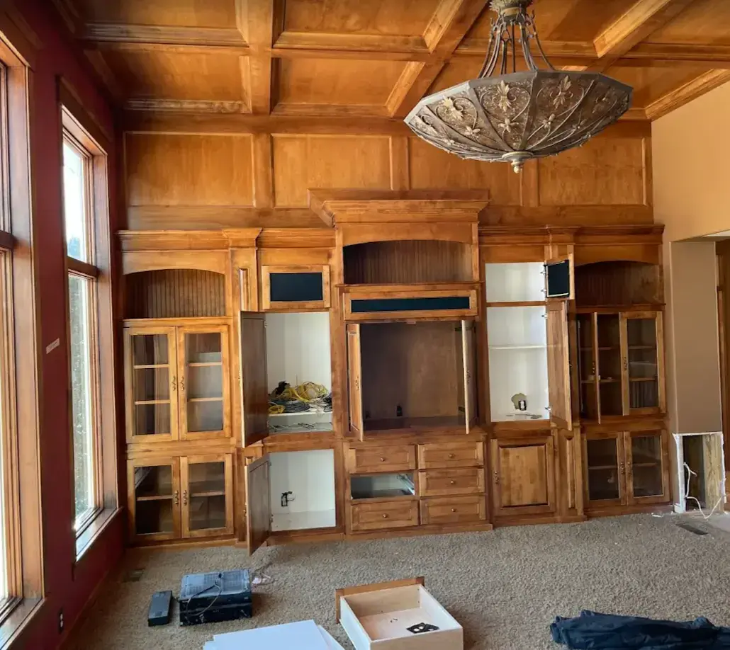 Before — Living room with freshly painted walls and a feature fireplace