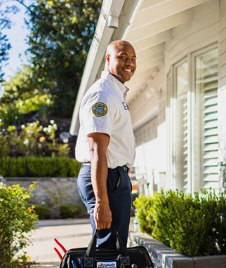Plumbing technician arriving for residential service